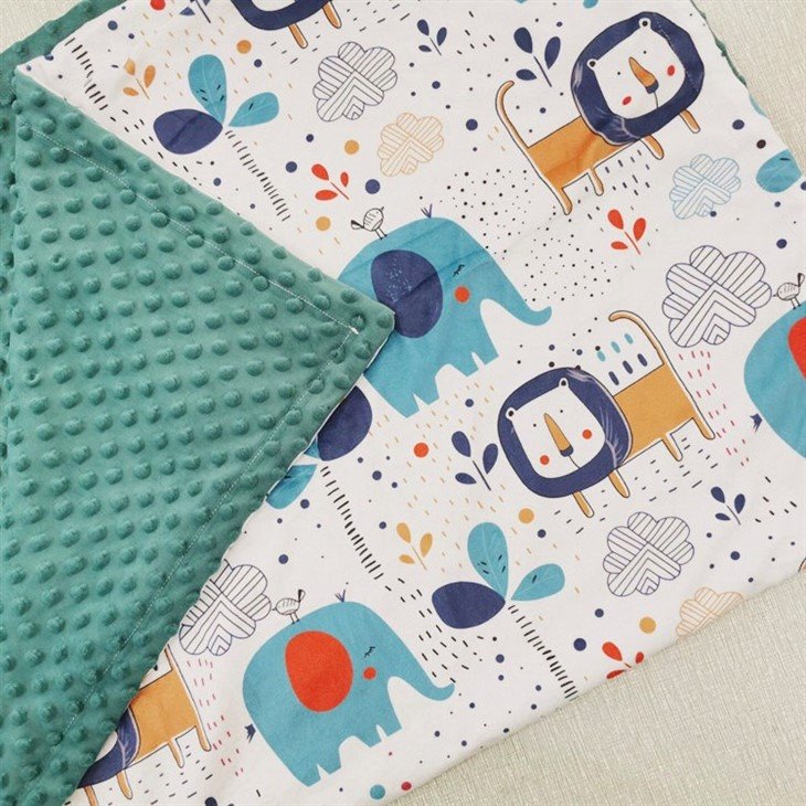 baby blanket with plush toy